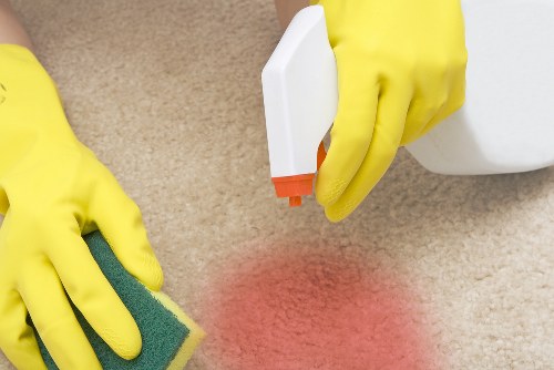 Carpet cleaning team following safety procedures in a clean workspace