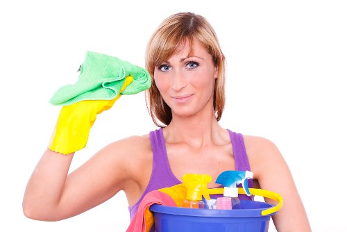 Technician managing a carpet cleaning job with safety precautions