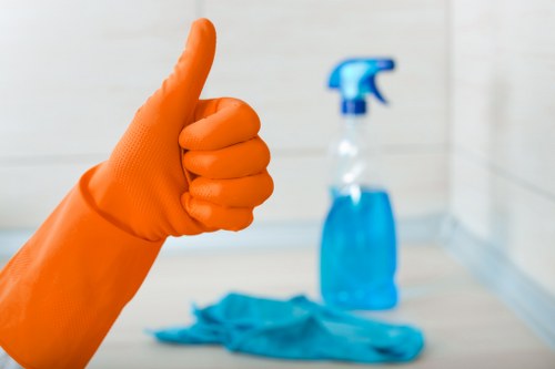 Technician using protective measures during carpet cleaning